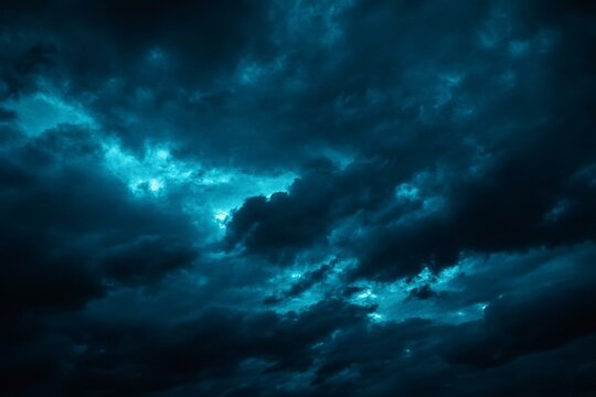 Black green blue night sky with clouds. Dark dramatic skies background for design. Cloudy rainy windy stormy weather.