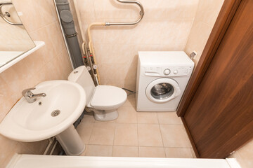 modern bathroom room with toilet and washing machine