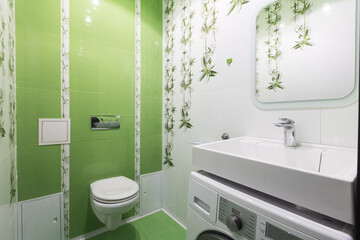 modern bathroom room with toilet and washing machine