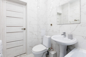 modern bathroom room with toilet and washing machine