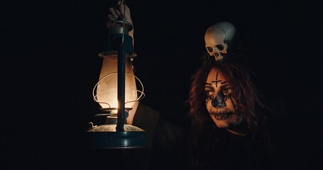 A Mystical Figure Holding a Lantern and a Skull Within a Dark, Enigmatic Setting