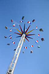 People in the pods of a carousel
