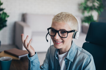 Young woman in casual outfit working remotely and communicating online