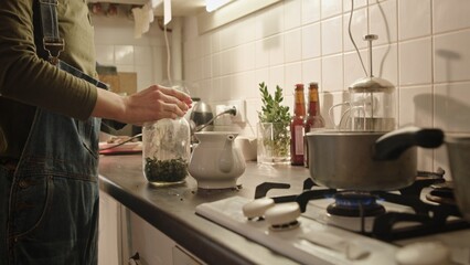 A Person Preparing Ingredients in a Cozy Kitchen Filled with Warm Ambiance and Authentic Charm