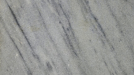 The surface, with its elegant white marble pattern featuring gray veins, serves as a sophisticated and timeless background