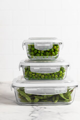 green peas in glass container for storage and cooking, healthy lifestyle, vegetable protein,...