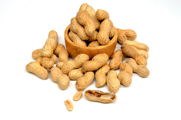 Peanuts in wooden bowl isolated on white background.