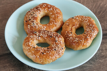 Quick bagels on a wooden background, top view