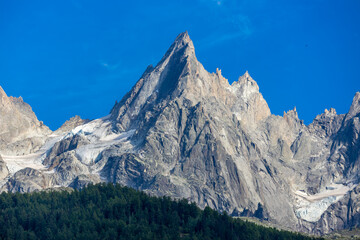 Fototapeta premium Aiguilles de Chamonix rocky granite mountain peaks in french Alps around Mont Blanc summit in Chamonix valley. Scenic landscape of iconic alpine summits the legends of mountaineering and alpinism