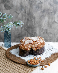 Colomba - Italian traditional Easter bread is topped with pearl sugar and almonds in the shape of a dove. Festive pastries are traditional in Italy.