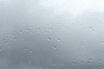 Raindrops on window glass. Rainy weather.