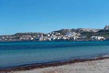 Scenic View of Mellieha Bay, Malta &ndash; Crystal Clear Mediterranean Waters and Coastal Town