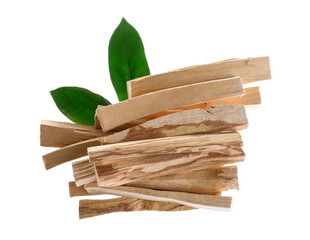 Palo santo sticks and green leaves on white background