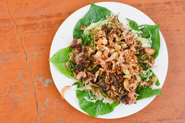 Fried frog with garlic on a plate