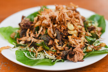 Fried frog with garlic on a plate