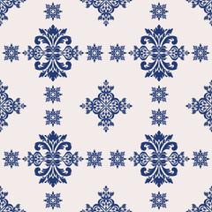 Elegant seamless vector pattern with intricate Damask floral motifs in deep blue. Perfect for luxury wallpaper, interior decor, textile design, and premium packaging projects with a classic touch.
