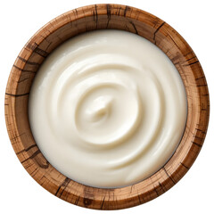 A bowl of cream and cream cheese on a wooden board with fresh ingredients