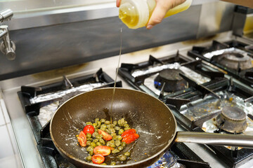 Drizzling Oil Over Sautéing Vegetables