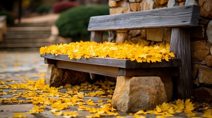 A weathered wooden bench covered in golden autumn leaves sits outdoors