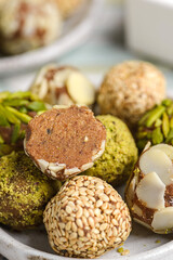 vegan energy balls with pistachios, sesame seeds and almond