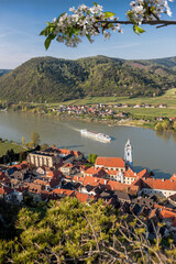 Dürnstein village with ship on Danube river during spring time in Wachau, Austria