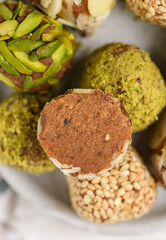 vegan energy balls with pistachios, sesame seeds and almond