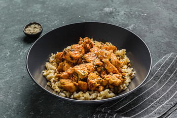 chicken in curry sauce with rice and sesame seeds