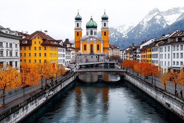 Obraz premium Scenic view of a colorful town with a church and autumn foliage.