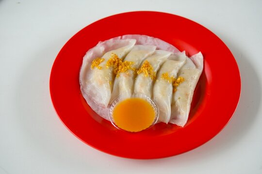 A plate of Choipan or Choi Pan, Chai Kueh , Chai Kue , Chai Kwe , Chai Kuih is a traditional steamed jicama, taro and chives dumpling with dried shrimp.