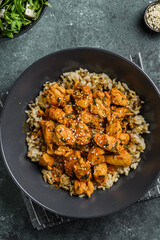 chicken in curry sauce with rice and sesame seeds