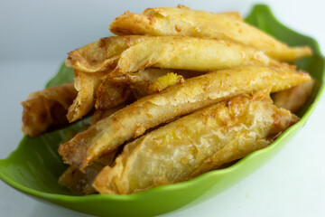 fried roll with caramel banana filling inside
