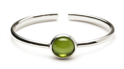Fototapeta premium A minimalist gemstone bracelet featuring a sleek peridot stone on a thin sterling silver band.