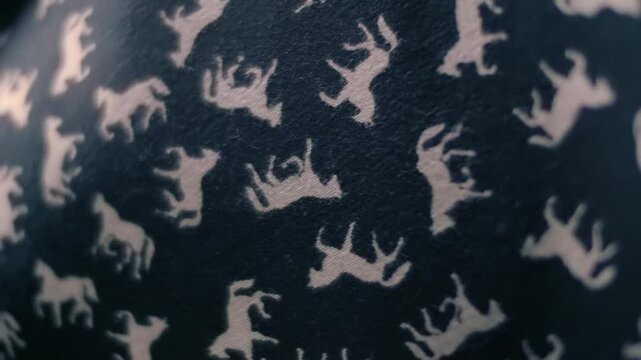 Black fabric with white horses fluttering in the wind. Closeup. Macro. Slow mo, slow motion, high speed camera, 200fps