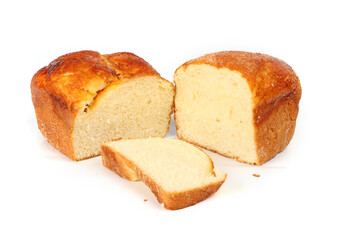 Homemade brioche cut in half on a white background