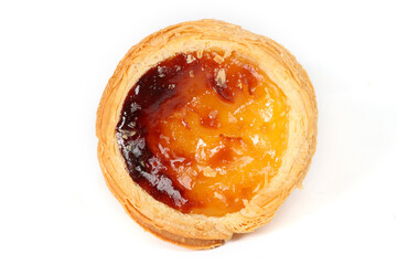 Pasteis de nata, a small Portuguese pastry, a custard tart in a flaky puff pastry, on a white background