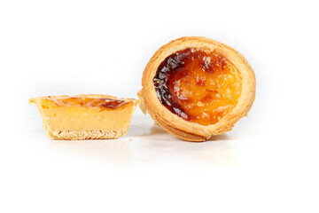 Pasteis de nata, a small Portuguese pastry, a custard tart in a flaky puff pastry, on a white background