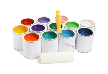 Cans of different paints and roller isolated on white