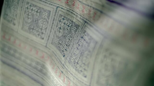 Fabric with beautiful geometric patterns flutters in the wind. Closeup. Macro. Closeup. Macro. Slow mo, slow motion, high speed camera, 200fps