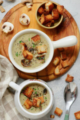 Creamy champignon soup with croutons.top veiw