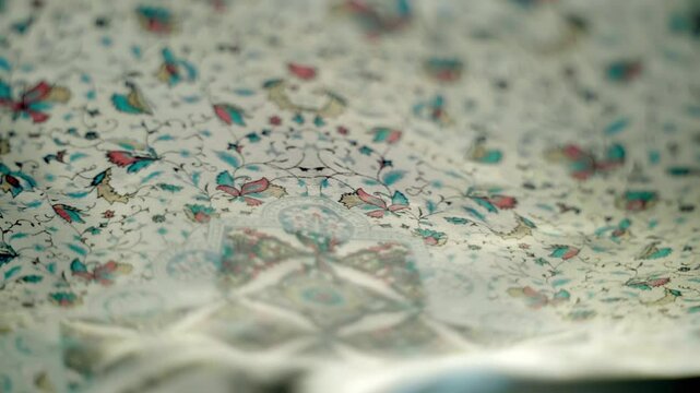 Fabric with beautiful colorful floral patterns flutters in the wind. Closeup. Macro. Closeup. Macro. Slow mo, slow motion, high speed camera, 200fps