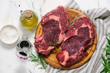Raw beef  steak with spices and olive oil .style hugge.top veiw