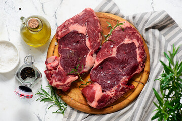 Raw beef  steak with spices and olive oil .style hugge.top veiw