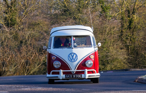 Stony Stratford,UK - Mar. 2nd 2025:  1967 Volkswagen Camper Van classic car driving on a British road.
