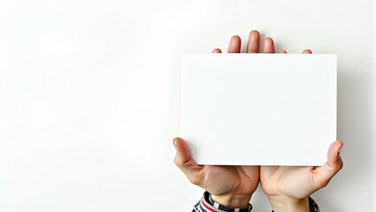 Obraz premium A Woman's Hand Holding Blank Paper: Symbolizing Creativity and Potential in Stock Photography