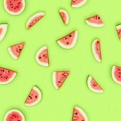 Patterns background-wallpaper of sliced watermelon slices on a light green pastel background