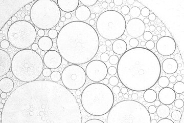 Macro soda bubble texture,Soda water with ice as background, closeup,collection water bubble black oxygen air, in underwater clear liquid with bubbles flowing up on the water surface, 