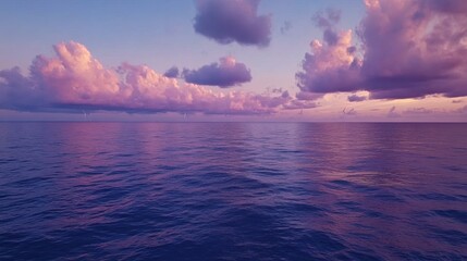 Calm Ocean View at Sunset with Purple Clouds and Wind Turbines