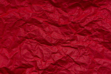 Red crumpled paper backdrop,Red crumpled paper textured background,Red color crumpled paper for background.