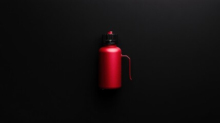Obraz premium Stylish red water bottle on a black background