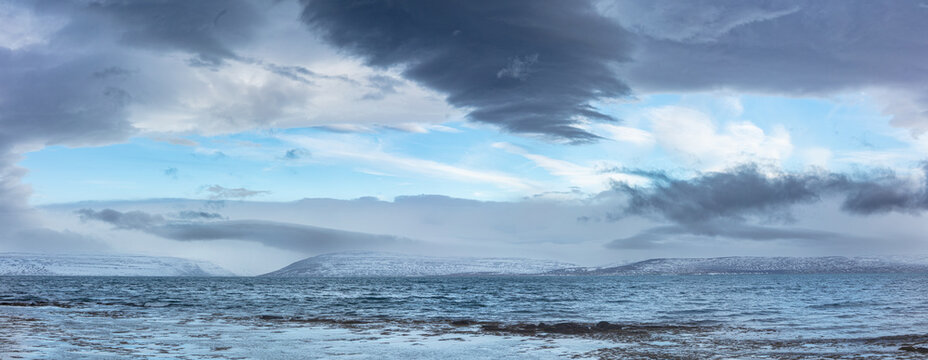 Seascape with turbulent water and stormy sky in northwest Iceland
